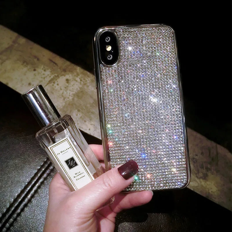 Silver glitter diamond pattern silicone phone case with crystals for iPhone.