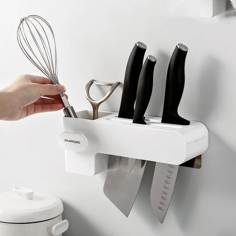 White plastic kitchen knife rack organiser with modern simple design on a countertop.