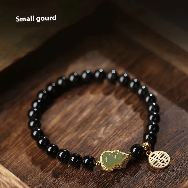 Natural black obsidian bracelet with Hetian jade gourd pendant in geometric bead design