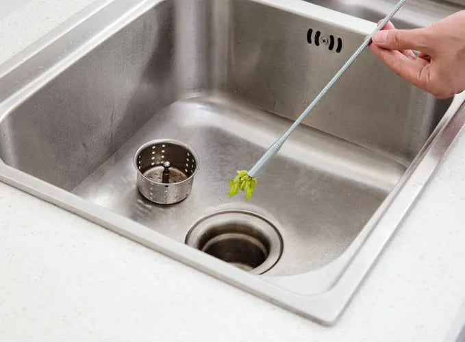 Black sewer dredger spring drain cleaning tool with handle and coiled end for pipe unclogging.