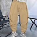Man wearing loose, cropped blue bamboo fibre casual trousers.