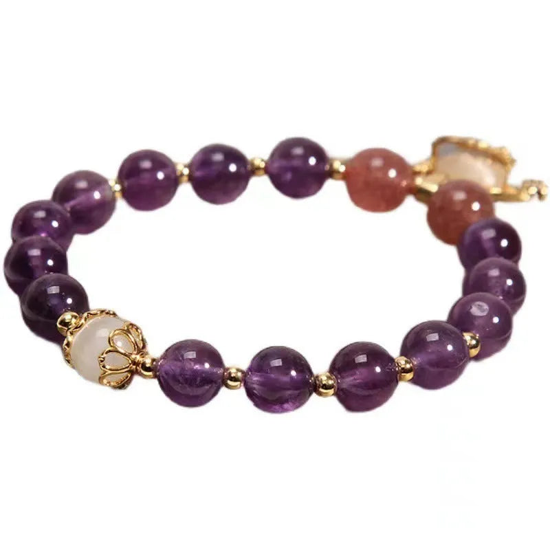 Women's handmade copper longevity lock bracelet with natural amethyst accents and safety lock charm