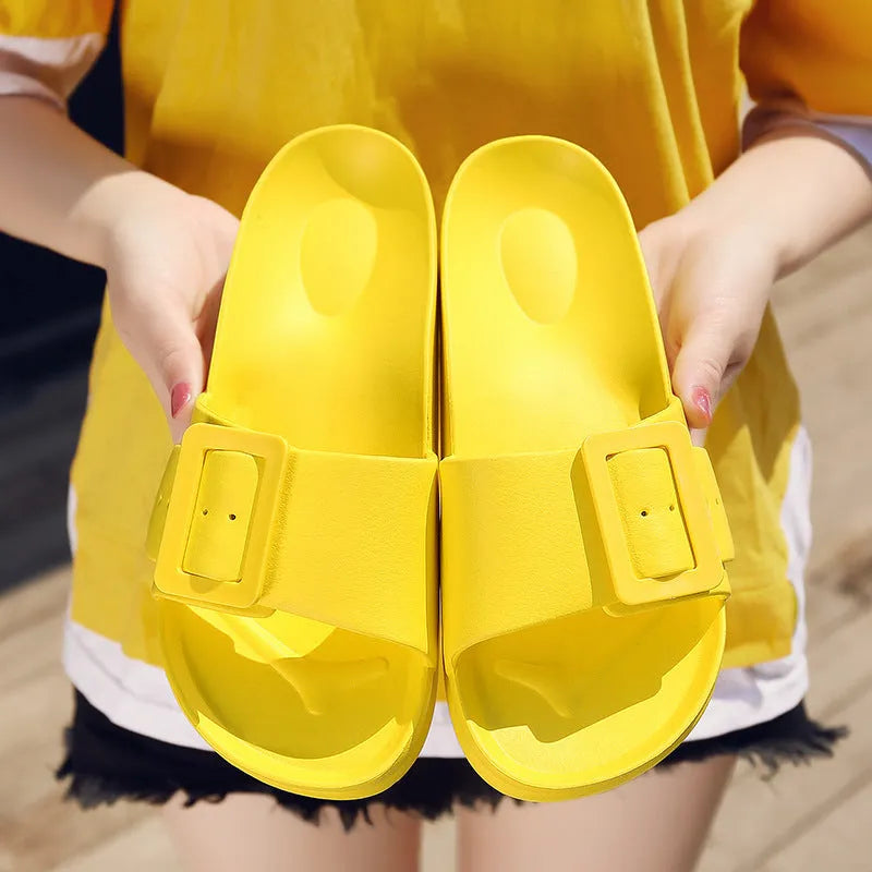 Women's grey blue flip-flop sandals with a buckle strap and soft EVA sole.