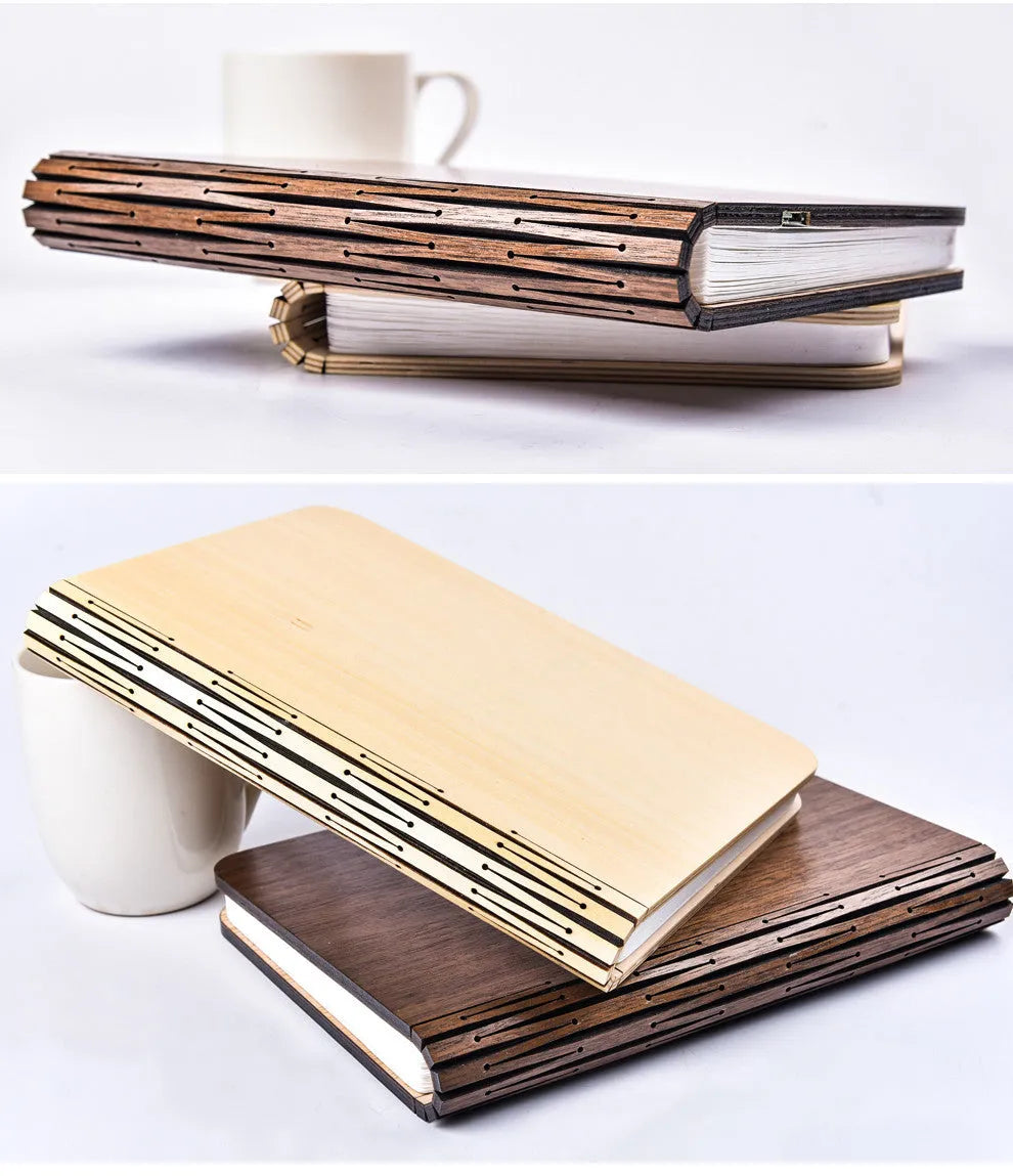 Walnut wooden book light open with colour changing LED pages on a desk