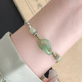 Green copper ethnic bracelet with a peace buckle and jade double rings, animal Zodiac modelling.
