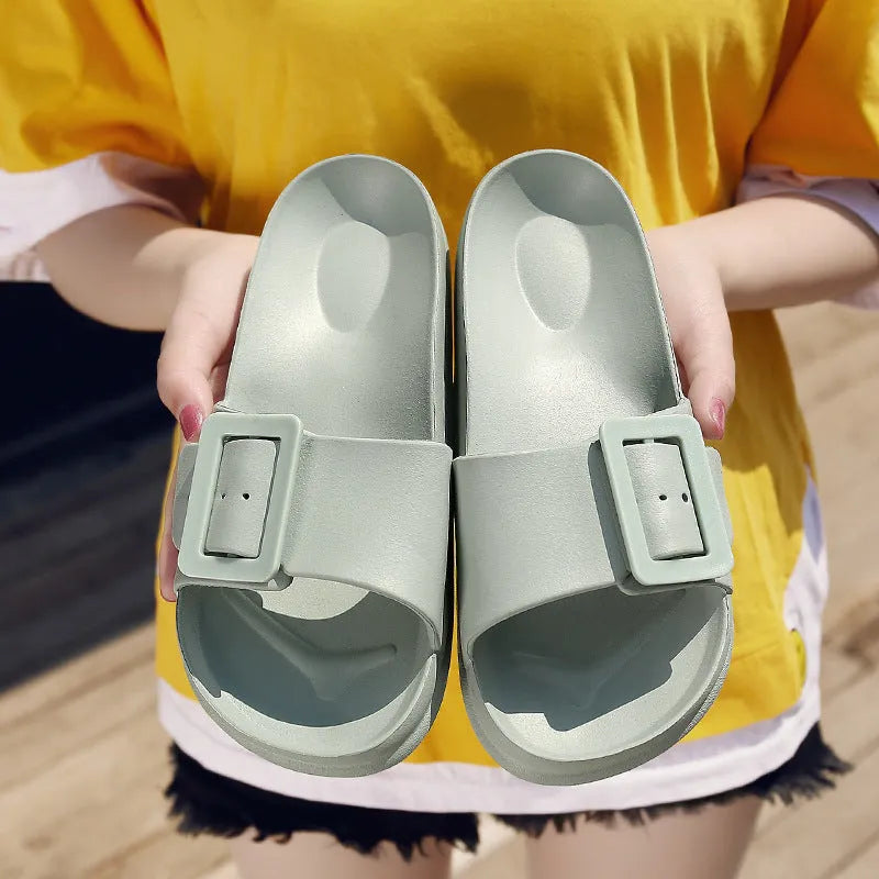 Women's grey blue flip-flop sandals with a buckle strap and soft EVA sole.