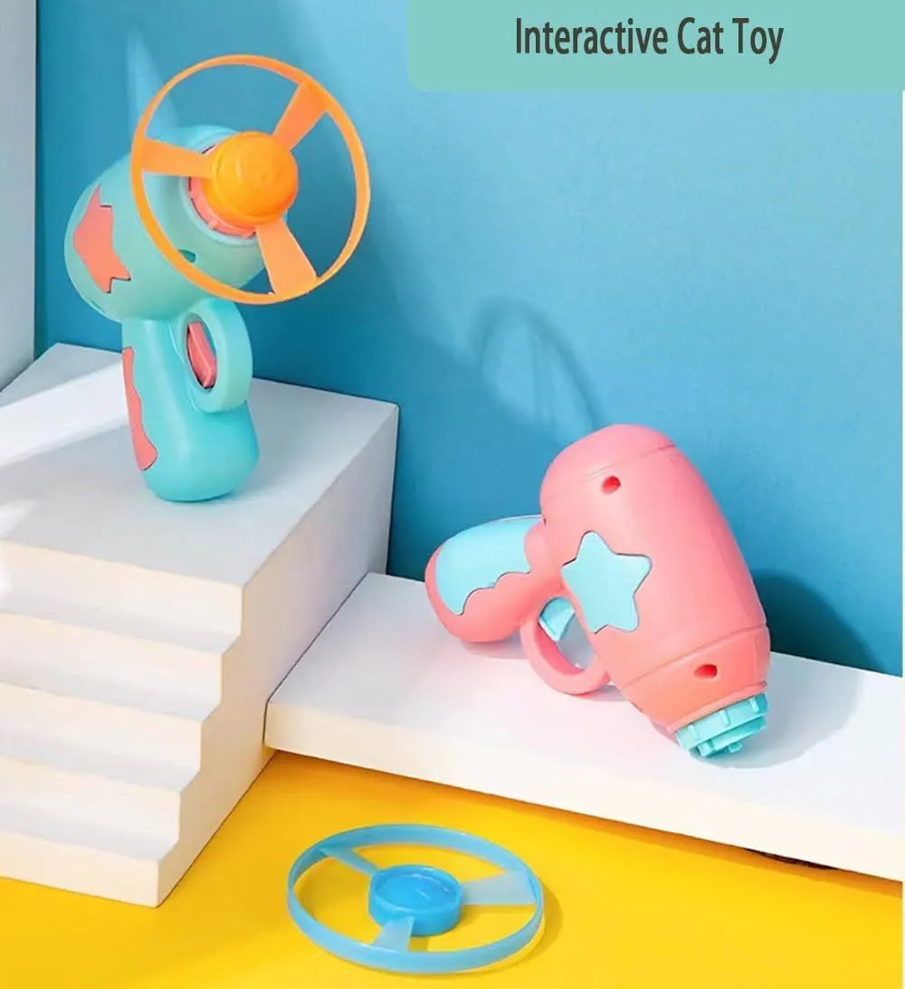 Interactive blue plastic cat toy gun with a spinning frisbee ready for launch.