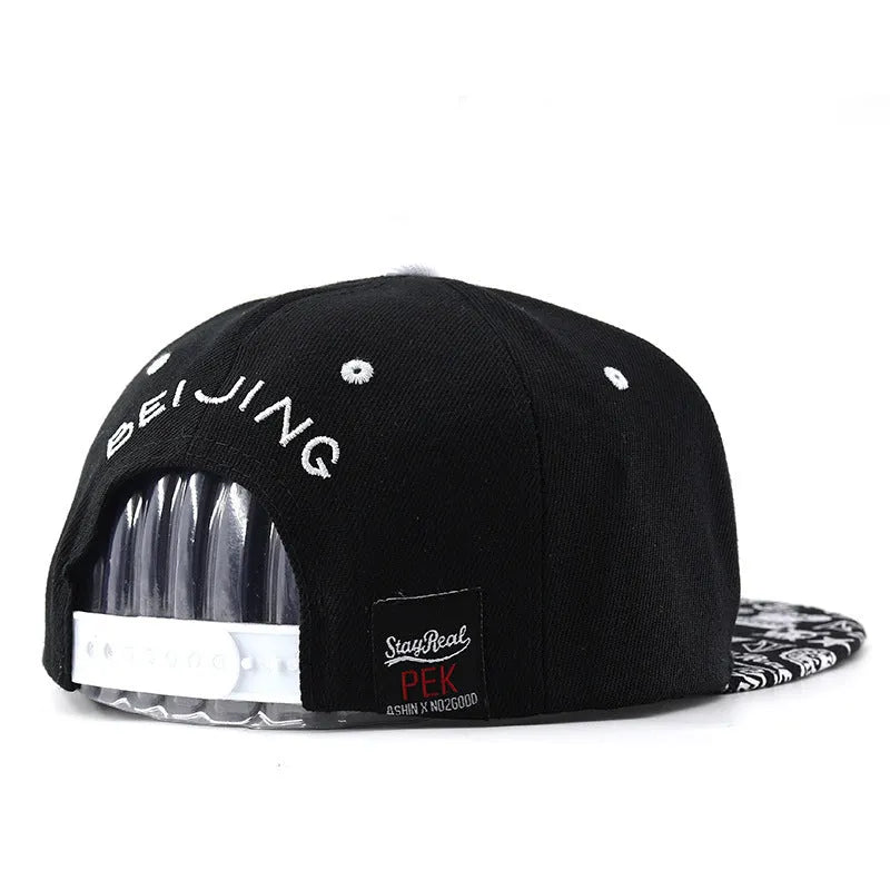 Cotton baseball hat with embroidered lettering in black colour showing adjustable strap