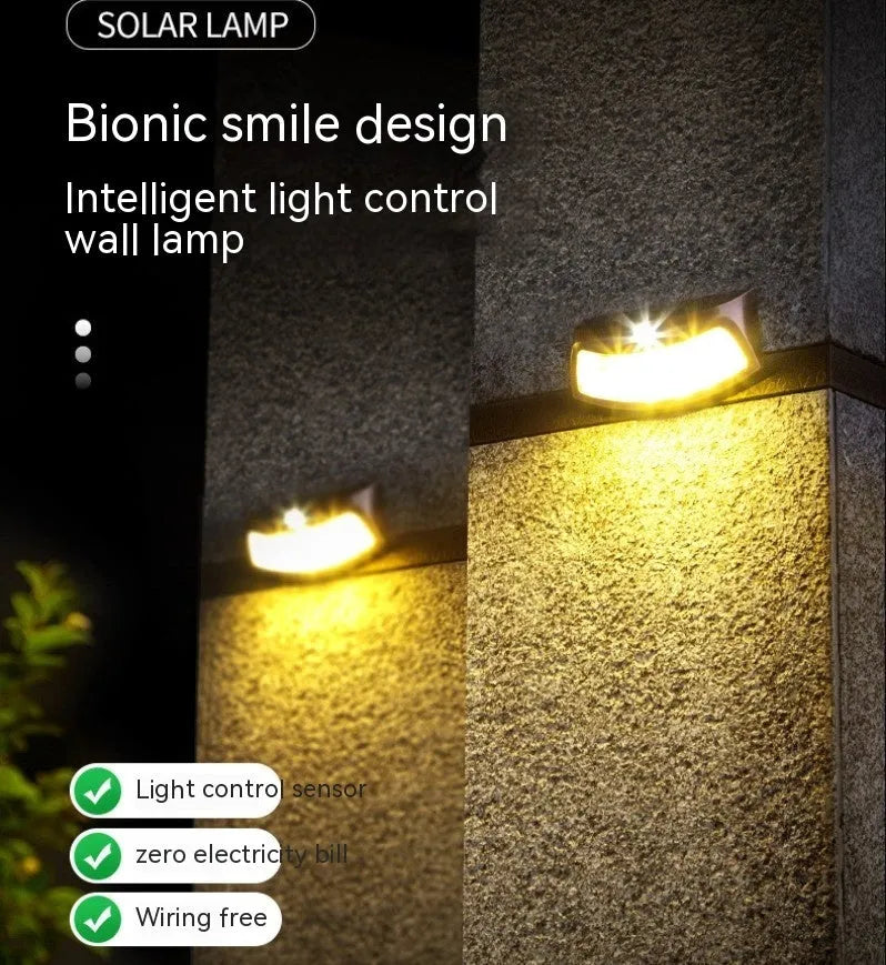 Solar outdoor wall lamp with smiling face design measuring 153mm wide