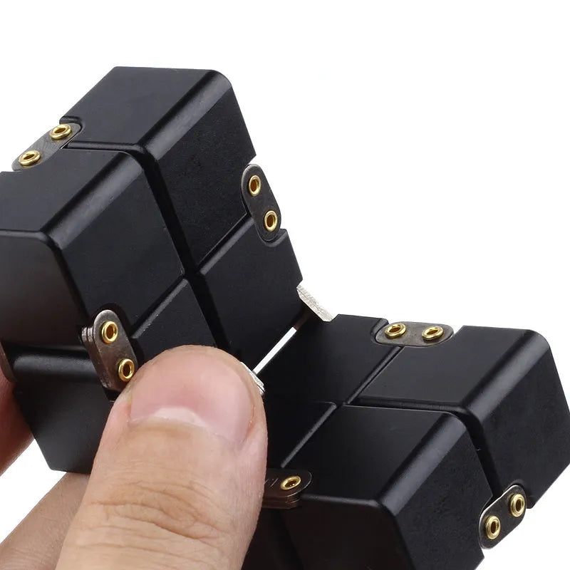 Zinc alloy infinity cube fidget toy showing rotating black cubes in 4cm metal construction