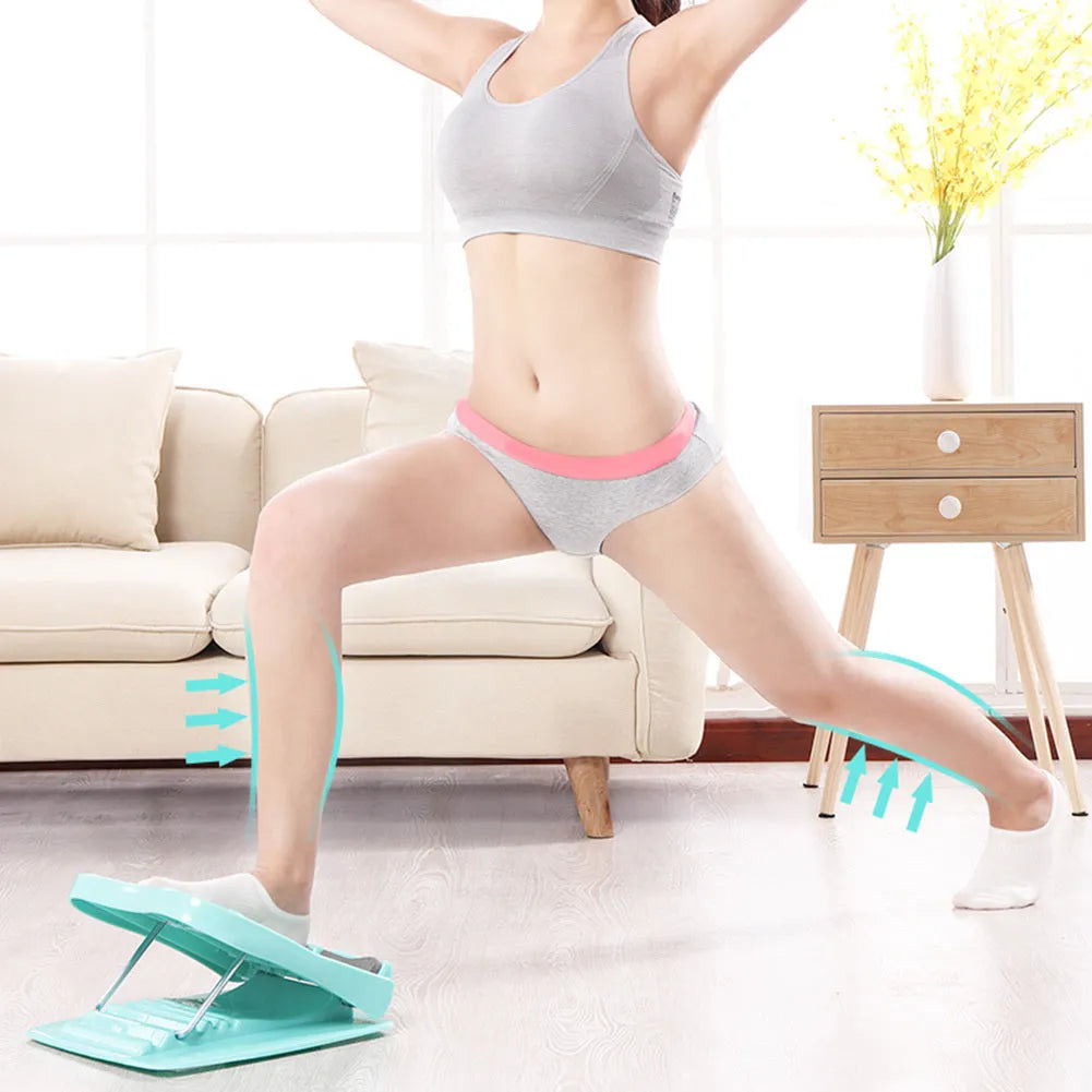 Portable black ABS calf stretching board with four adjustable incline positions on a textured surface