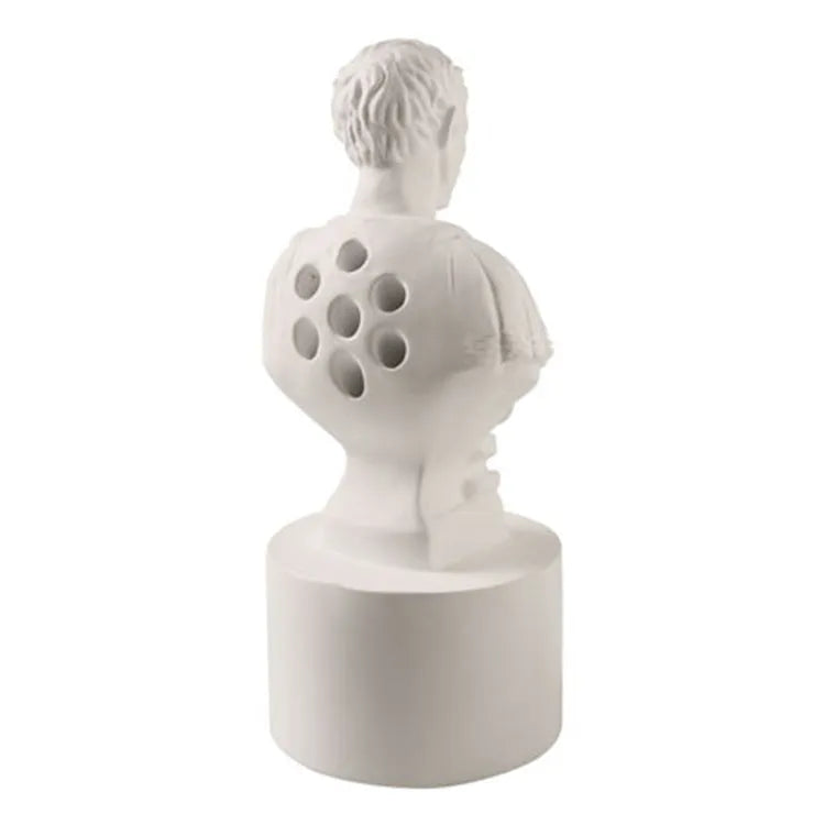 White synthetic resin American creative character modelling pen holder on a desk.