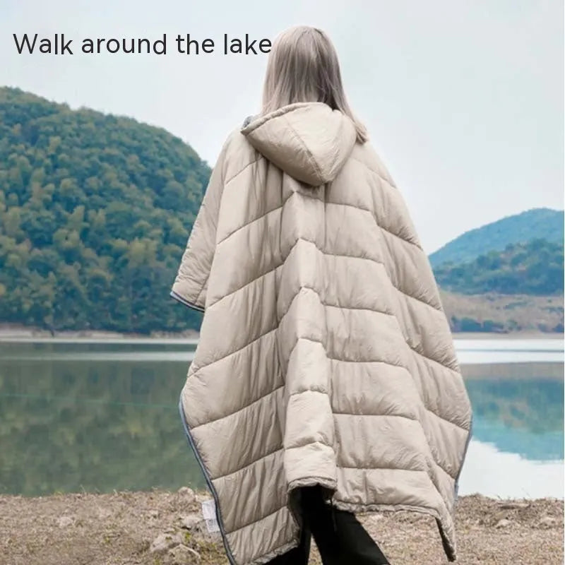 Army Green outdoor cloak sleeping bag worn as a cape, showing its 200x140cm size and nylon fabric.