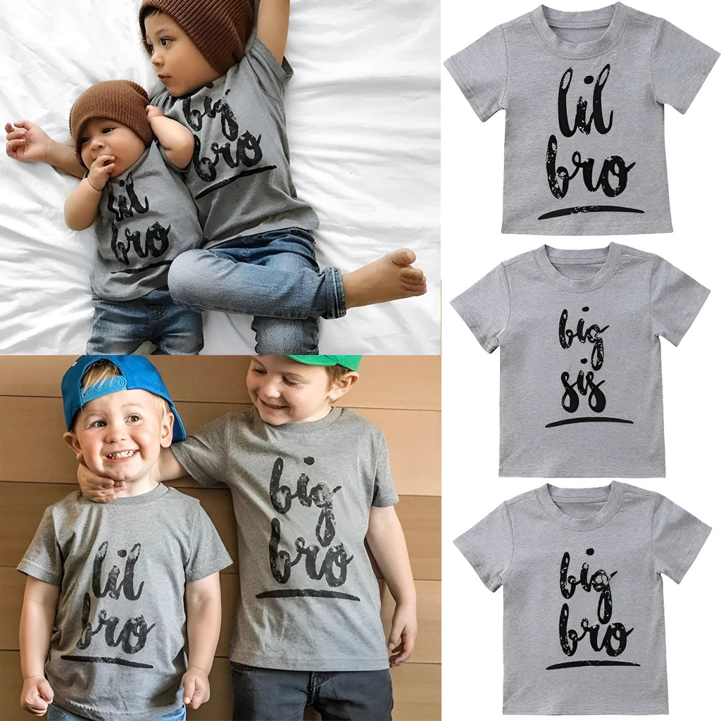 Grey cotton children's t-shirt with printed sibling graphic, showing size range from 60cm to 140cm.