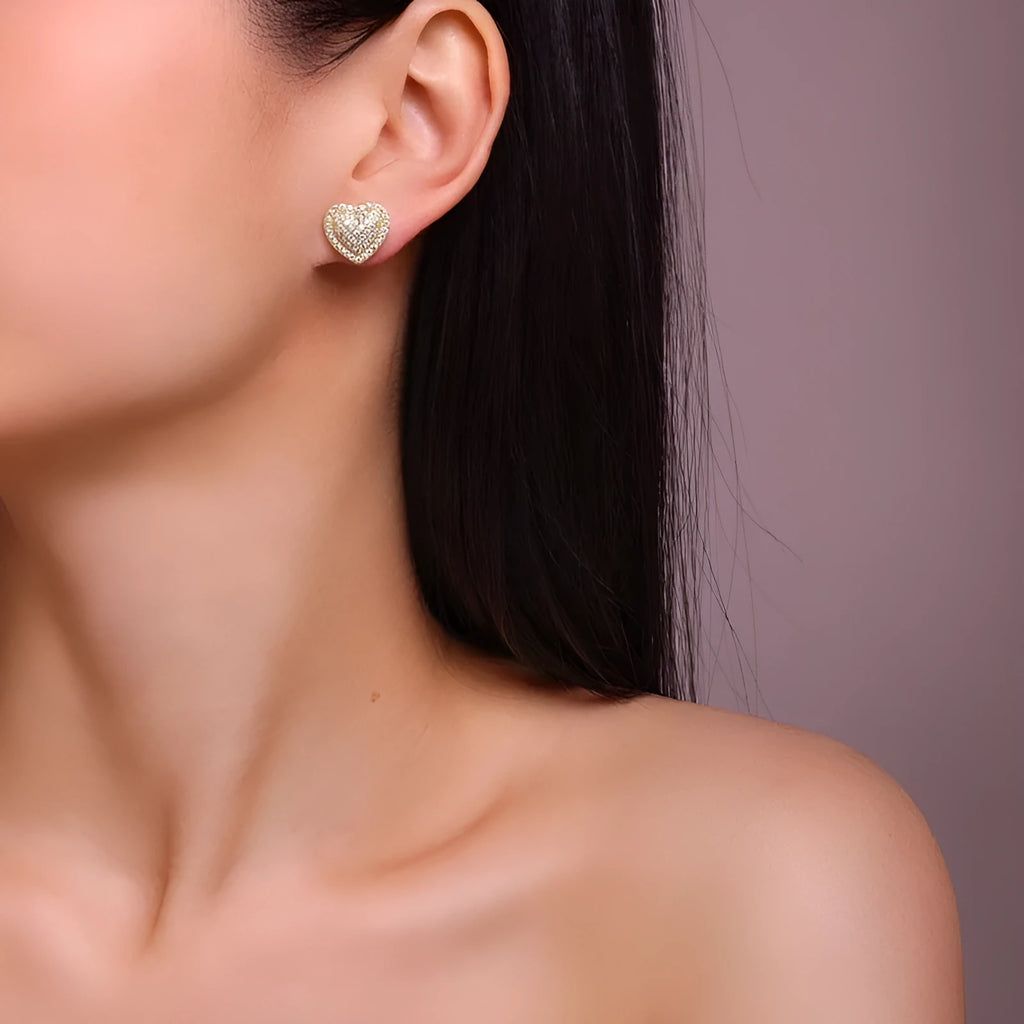 S925 silver gold moissanite heart-shaped stud earrings on white background