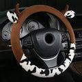 Short plush automotive steering wheel cover in black with protective handle, 38cm diameter