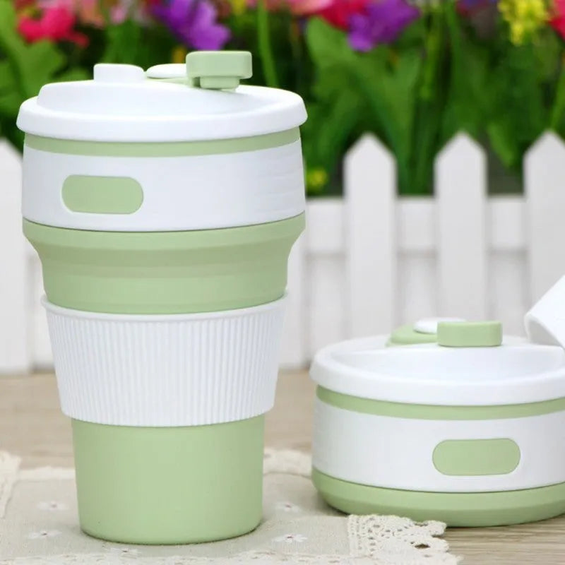 Green collapsible silicone travel cup shown both expanded and folded to 6cm height