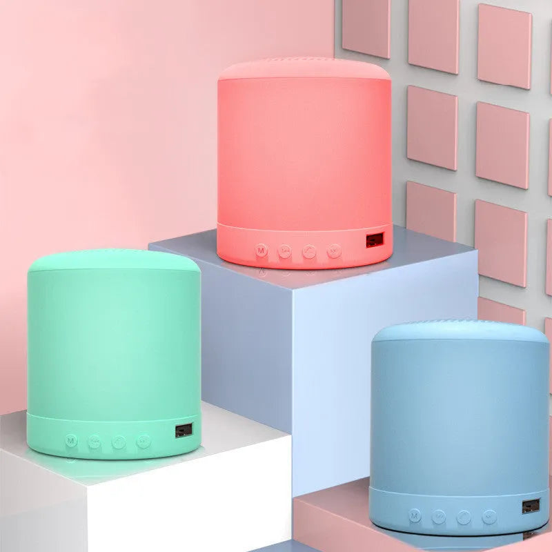 Small square A11 wireless subwoofer stereo speaker in black, pink, blue, or green colour.