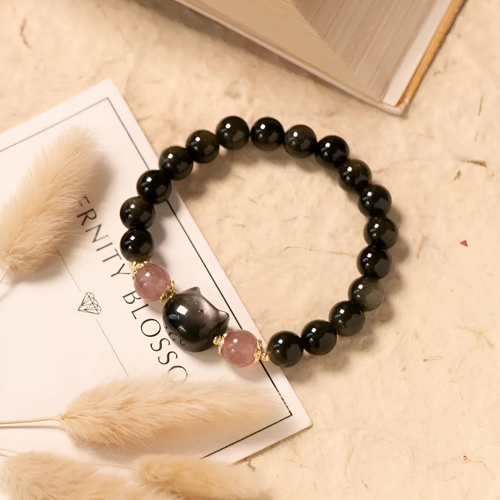 Black obsidian 8mm bead bracelet with silver kitty charms on adjustable closure
