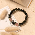 Black obsidian 8mm bead bracelet with silver kitty charms on adjustable closure
