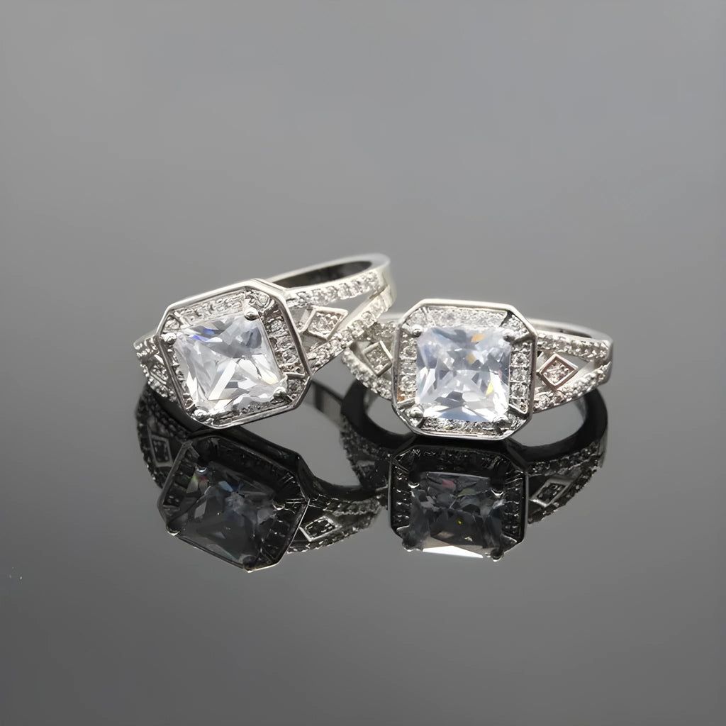 Geometric hollow zircon ring for women in platinum colour on copper, showing quadrilateral design and inlaid stones.
