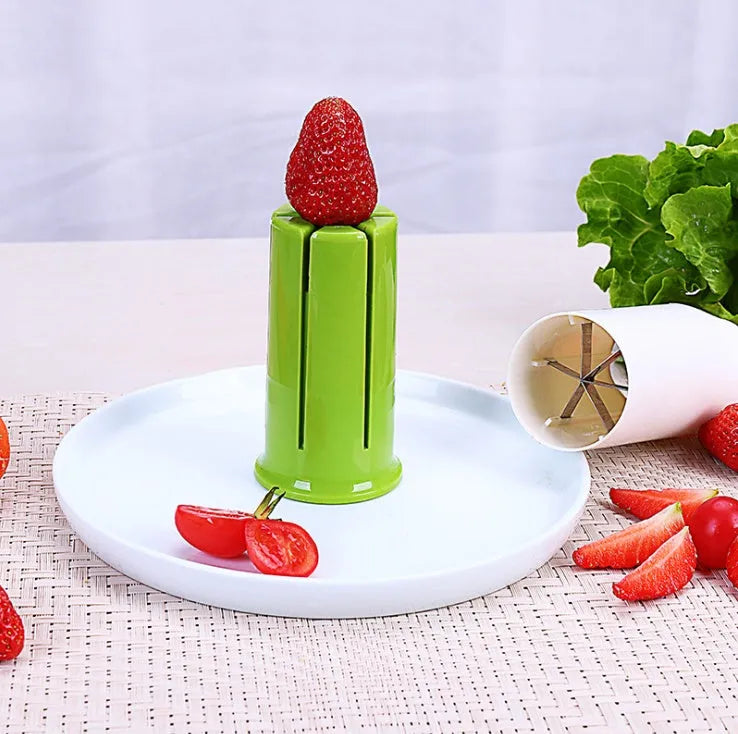 White kitchen vegetable and fruit slicer with multiple stainless steel blades.