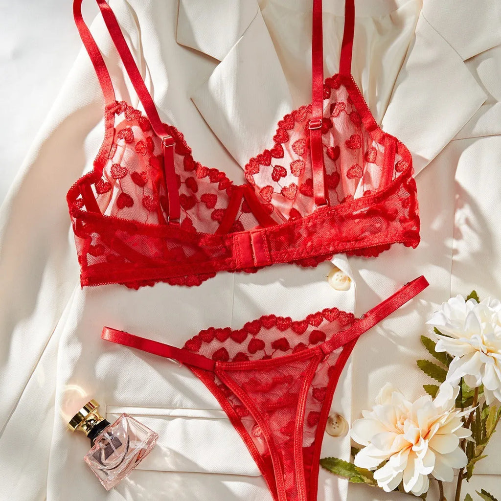 Women's two-piece mesh suit with romantic multi-colour overlay design, showing sleeveless top and matching trousers