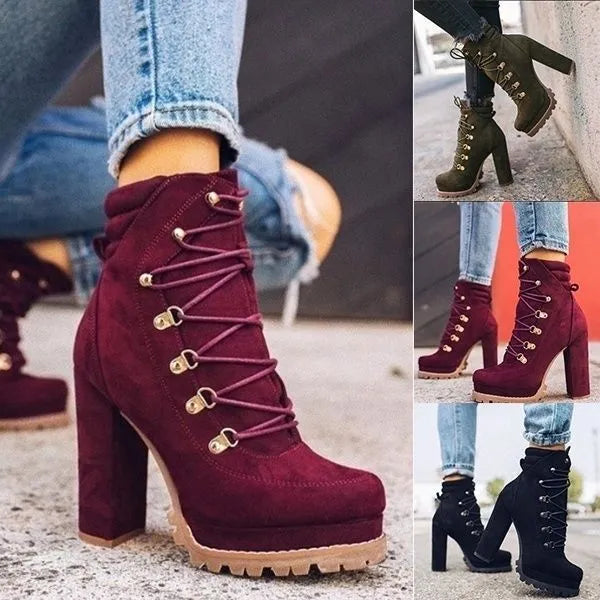 Women's army green suede Roman-style ankle boots with a thick high heel, round toe, and belt buckle detail.