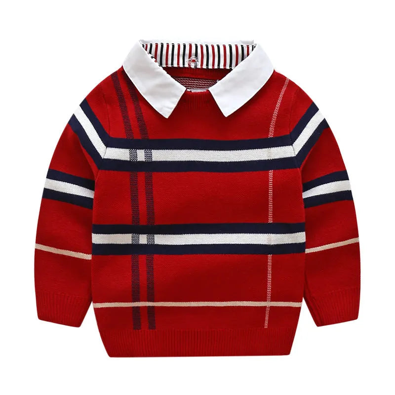 Boys apricot and navy blue plaid jacquard knit sweater with long sleeves on hanger.