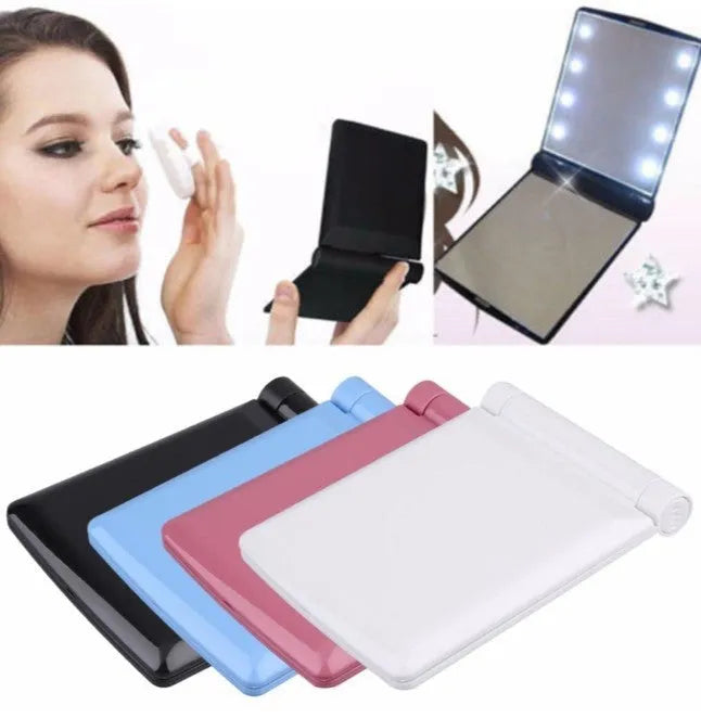 Folding LED pocket cosmetic mirror in Black, closed and open to show LEDs and compact size