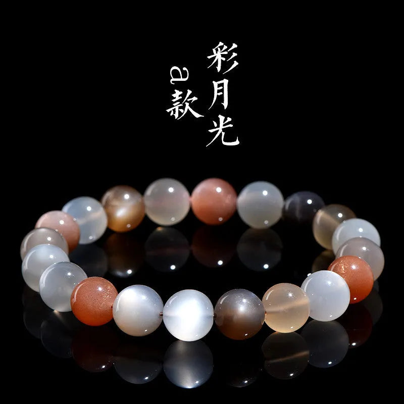 Natural colourful moonlight bracelet with 8mm moonstone beads on a wrist.