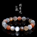 Natural colourful moonlight bracelet with 8mm moonstone beads on a wrist.