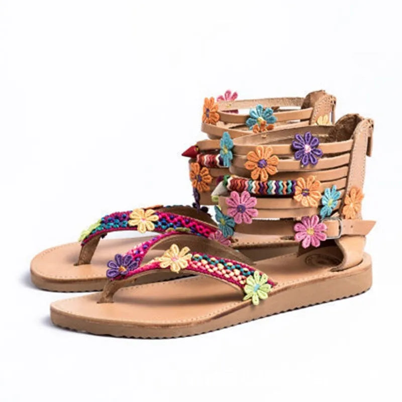 Ethnic style beaded petal sandals with floral design and round toe on artificial PU upper.