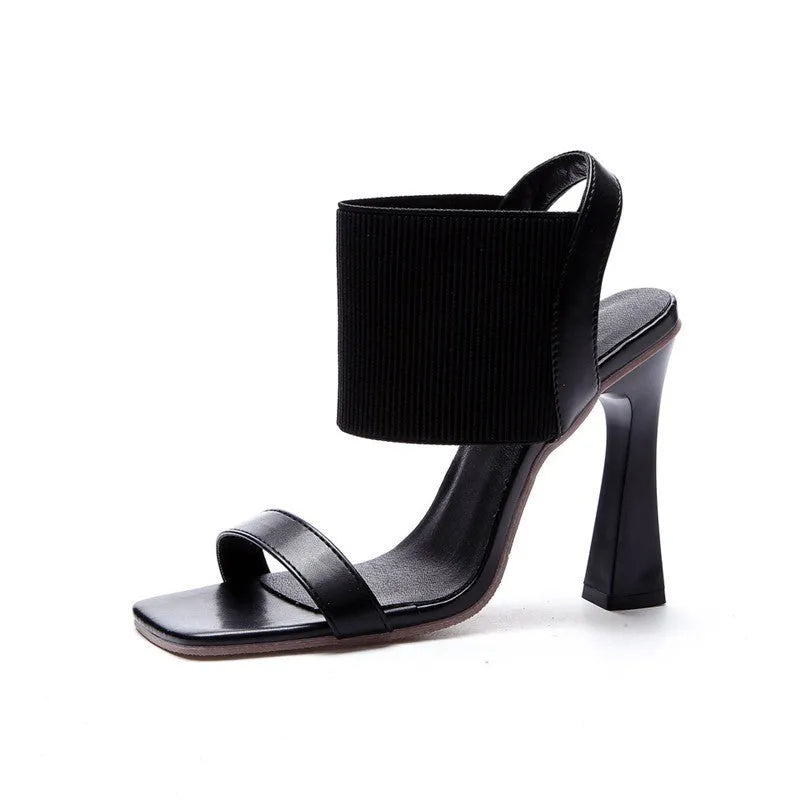 Women's black high heel sandals with elastic straps and rubber soles