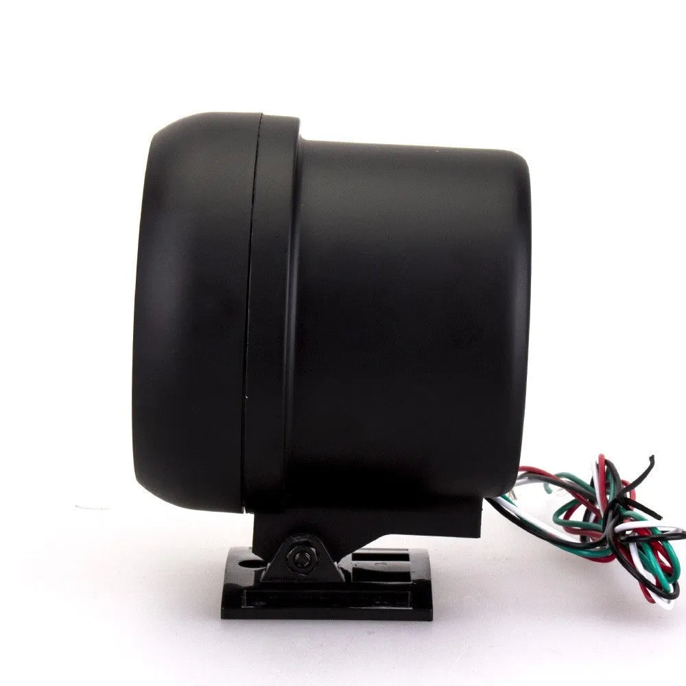 Black plastic automotive tachometer with blue light pointer display showing rpm scale