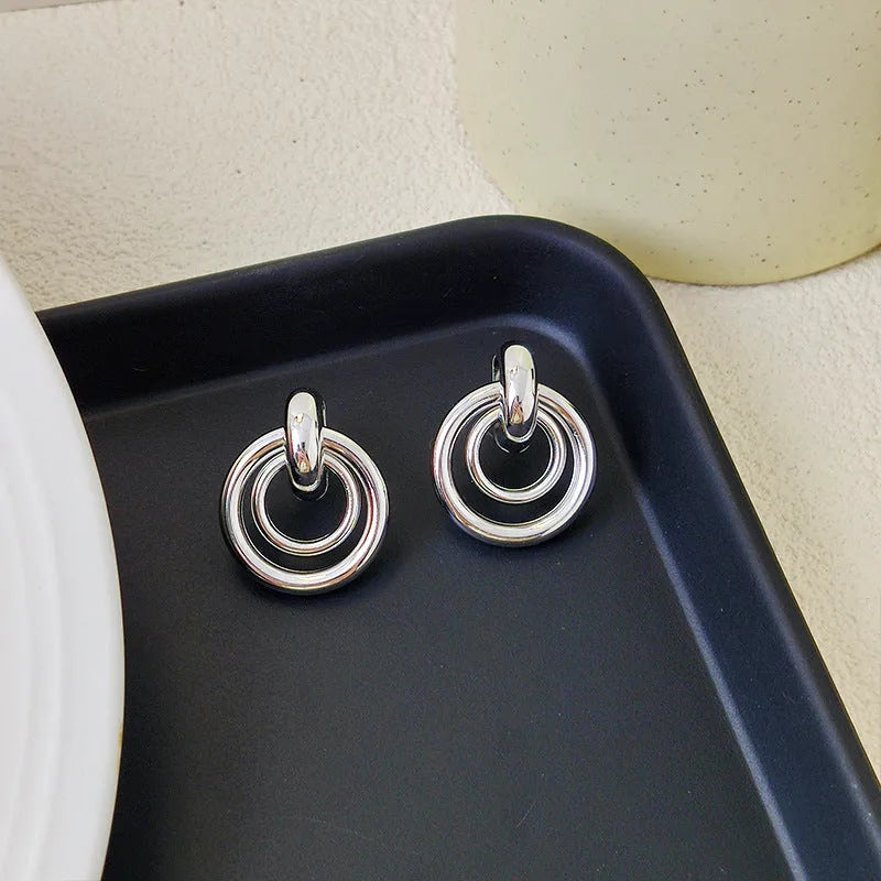 Geometric round ring drop earrings in gold or silver colour with irregular shape