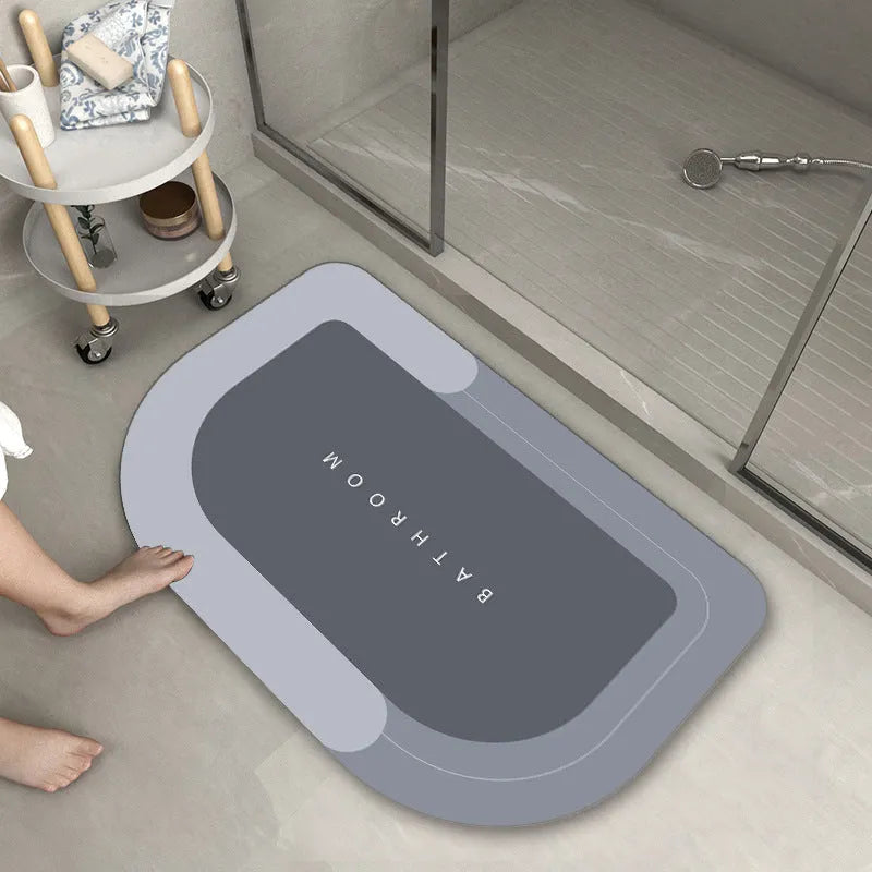 Blended fabric bathroom floor mat in blue colour, available in oval and rectangular shapes.