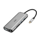 Grey 11-in-1 USB-C docking station with HDMI, VGA, USB ports, Ethernet, and card reader on a desk.