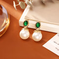 High-grade ruby pearl stud earrings with real gold plating on copper, round geometric shape, available in red or green