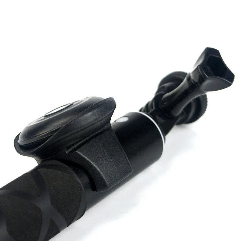 Black Bluetooth remote control for smartphone selfies and camera shutter.
