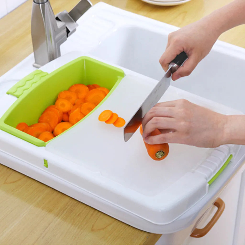 Green multi-function kitchen cutting board with integrated draining basket mounted on sink edge