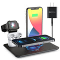 Black multifunction desktop wireless charger for phone, smartwatch and headphones on a wooden desk.