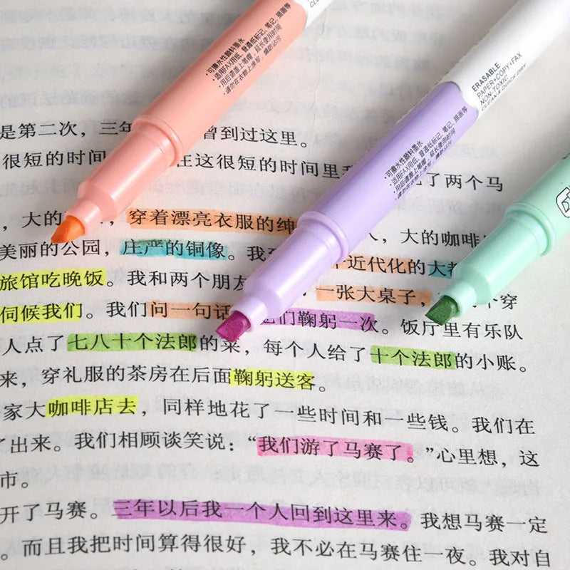 Six double-headed fluorescent marker pens in plastic casing with various coloured barrels