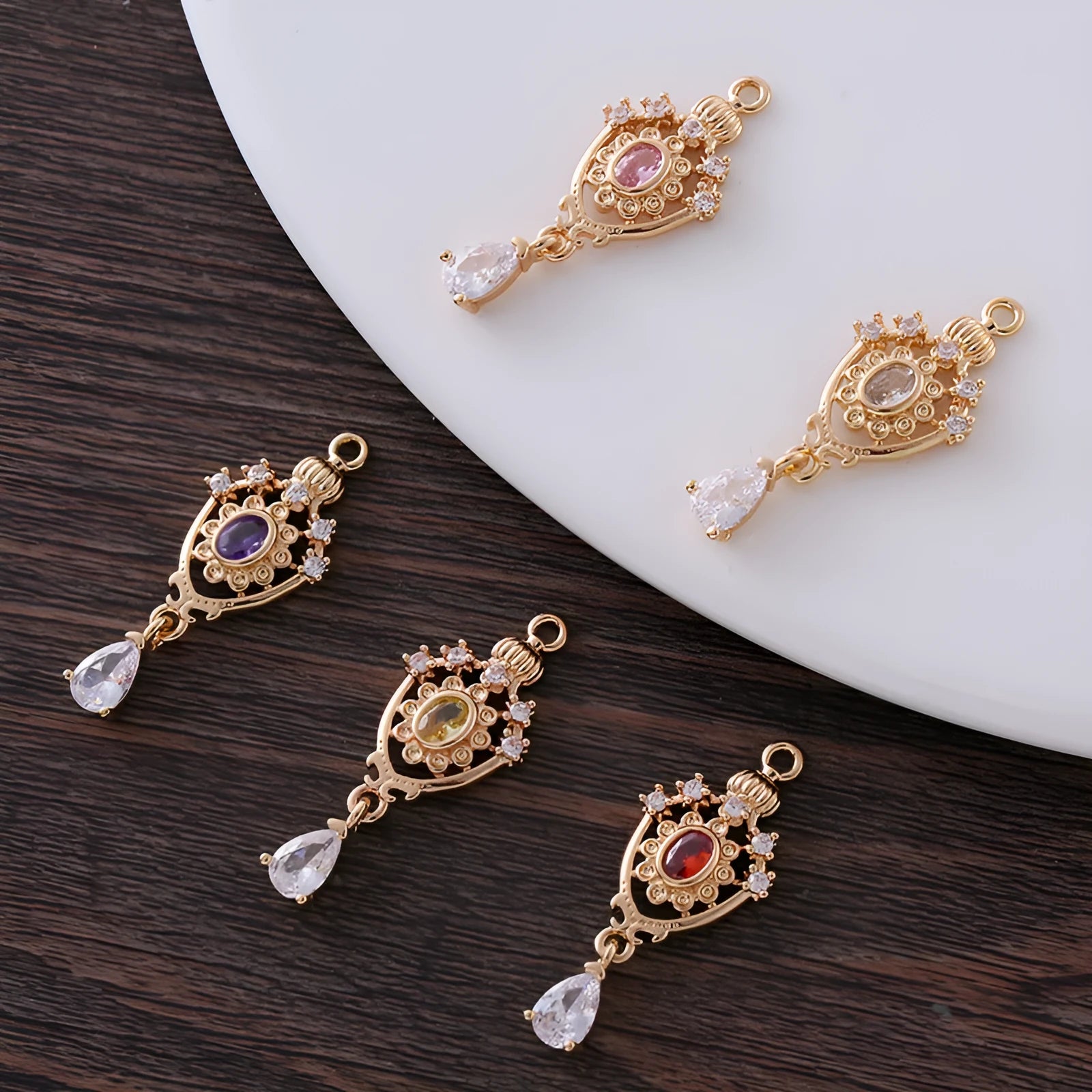 Water drop pendant with crown design in five colour options measuring 12mm by 23mm