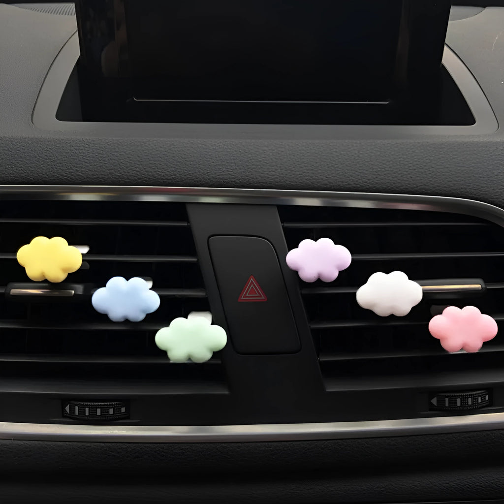 Resin Baiyun cartoon car fragrance clip in light green colour attached to a car air vent