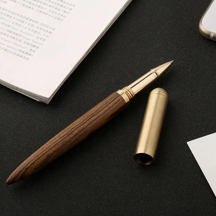 Brass and sandalwood signature pen with wooden barrel, shown alongside a ruler indicating 14 cm length.