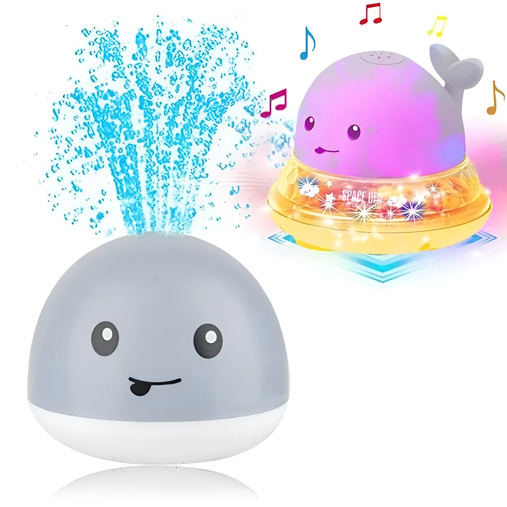 White and blue electric whale bath toy spraying water with flashing lights on a bathroom surface.