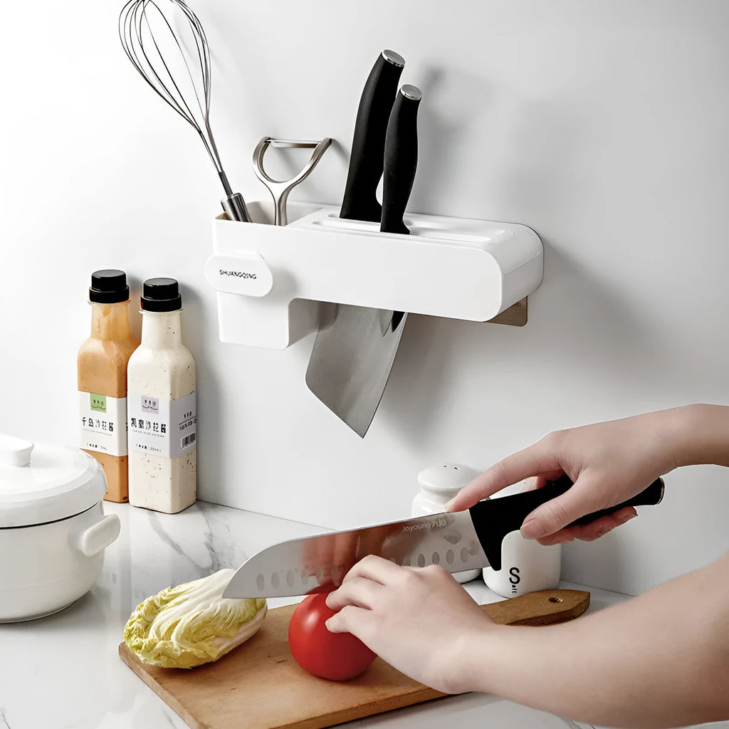 White plastic kitchen knife rack organiser with modern simple design on a countertop.