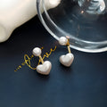 Heart-shaped pearl stud earrings with Korean design, alloy construction, electroplated finish and artificial gem accents
