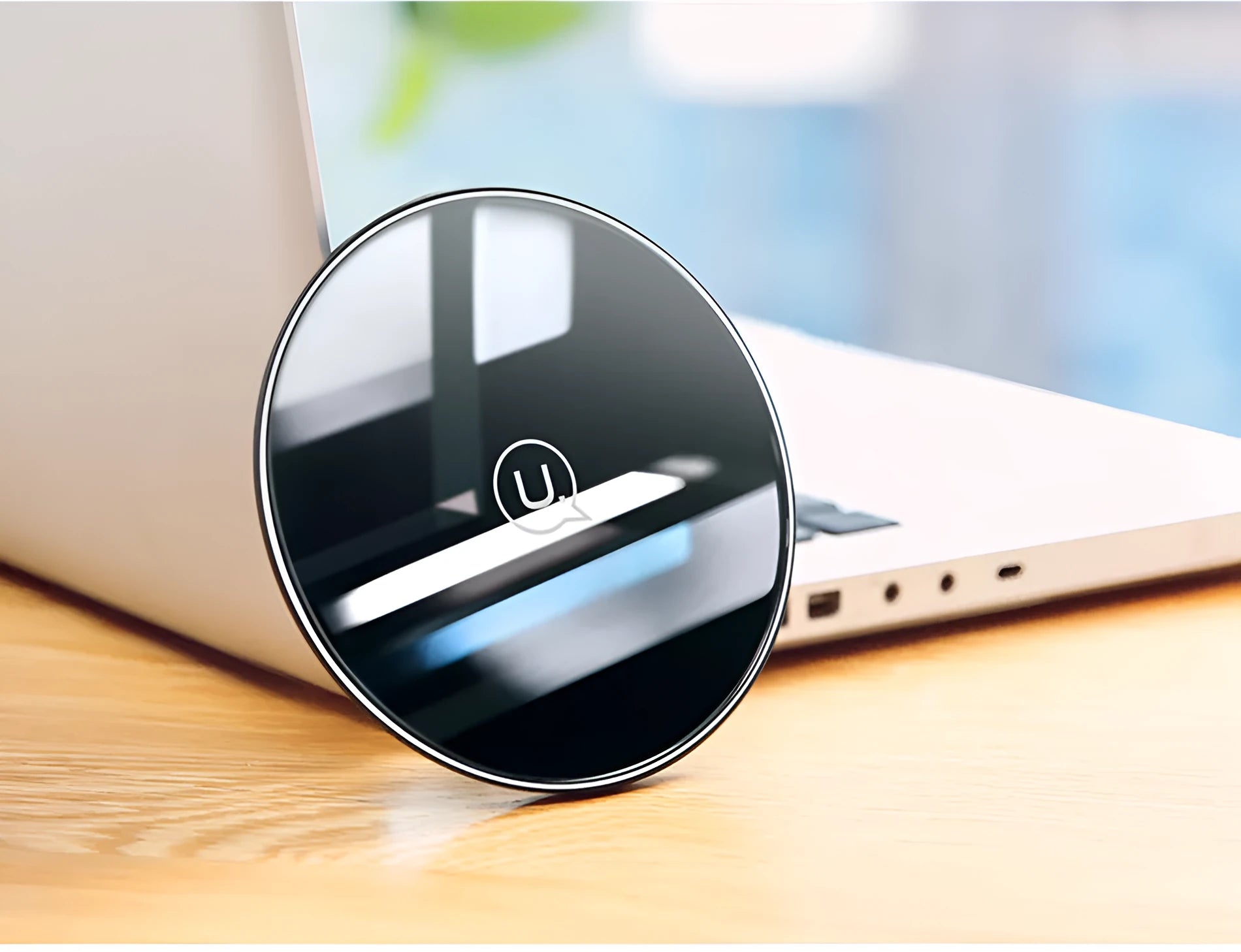 Glass disc wireless charger showing black and white colour options with charging indicator